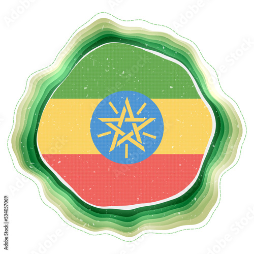 Ethiopia flag in frame. Badge of the country. Layered circular sign around Ethiopia flag. Awesome vector illustration.