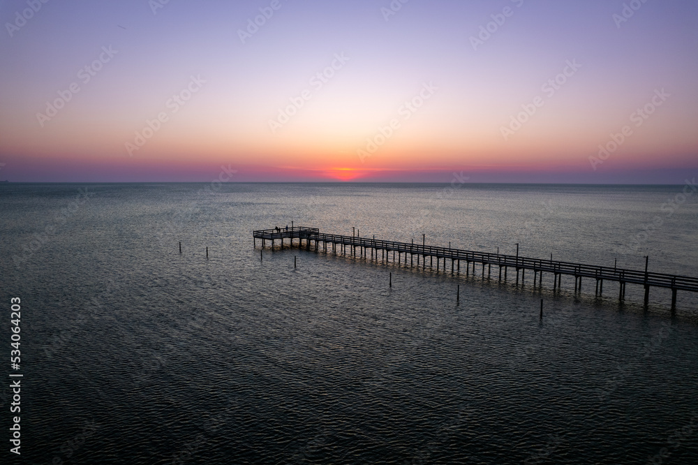 The sun setting over a fishing pier off the Eastern Shore of Virginia 