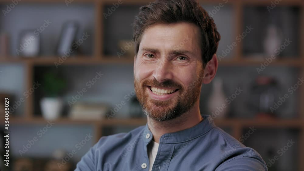Smiling bearded millennial professional businessman looking at the camera. Close-up business portrait Confident handsome adult entrepreneur, manager posing with a smile in the office. Smiling bearded millennial professional businessman looking at the camera. Close-up business portrait Confident handsome adult entrepreneur, manager posing with a smile in the office.