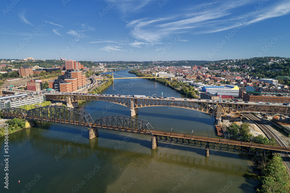 Pittsburgh Skyline with Downtown and Business District. Train Bridge and Liberty Bridge.