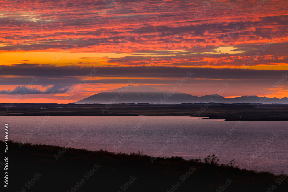 Colorful red Sunset over Snæfellsjökull and the Arctic Sea, in West Iceland