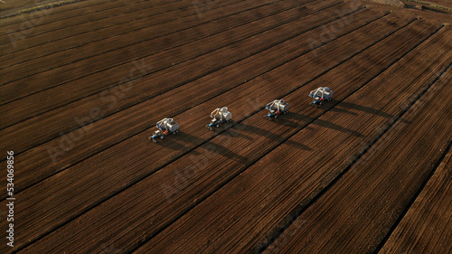 Harvesting peat with combines. Peat extraction process. Agriculture industry, peat farm