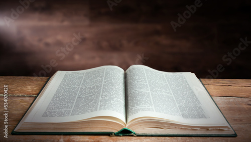 Open book on a wooden table