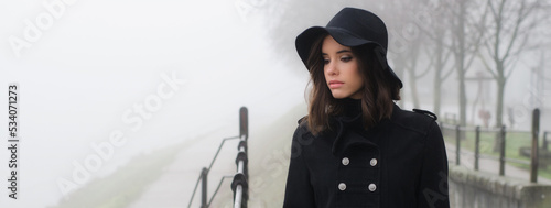Photography Beautiful lonely woman in black clothes walking in autumn mist