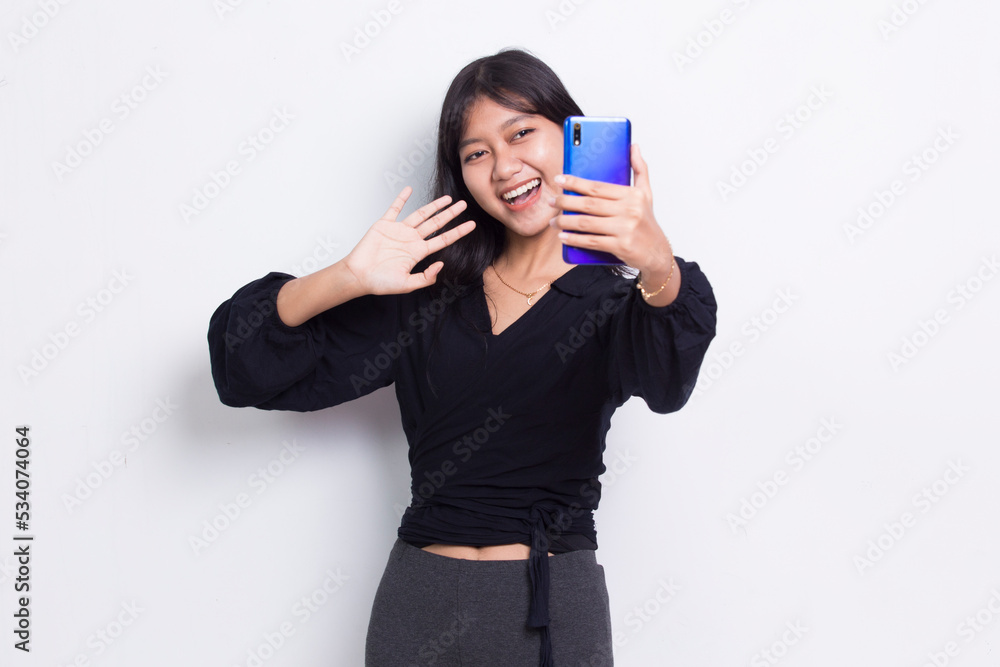 happy young asian beautiful woman using mobile phone isolated on white background
happy young asian beautiful woman using mobile phone isolated on white background