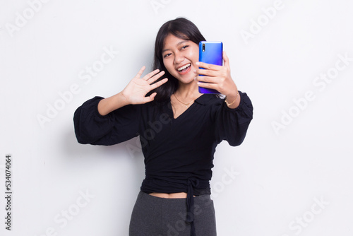 happy young asian beautiful woman using mobile phone isolated on white background 