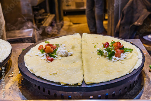 Crepes being made at a shop on El Moez street in Old Cairo. photo