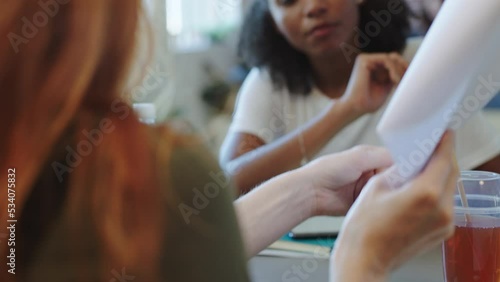 Lawyer black woman with document talking to client about legal paperwork, policy agreement or compliance contract and for trust, professional help and expert advice. Young law student help or working photo