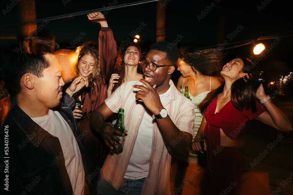 A group of people at a music festival at night.