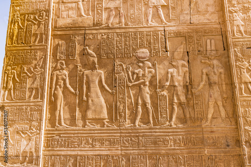 Carved mural featuring the crocodile god Sobek and falcon god Horus at the Kom Ombo temple.