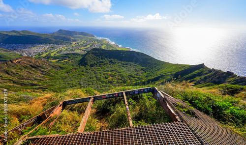 Aerial view of the Koko crater and of the Pacific Ocean on O'ahu island in Hawaii from the top of the volcano - Old steel mesh floor as part of an ancient mining site on a volcano