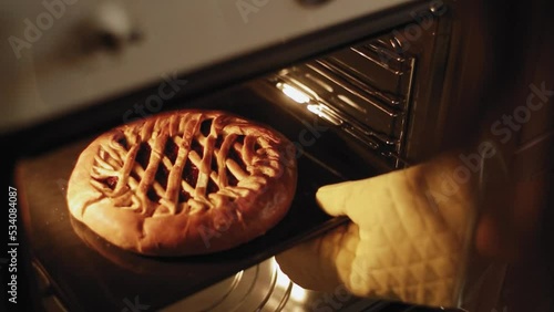 take the berry pie out of the oven