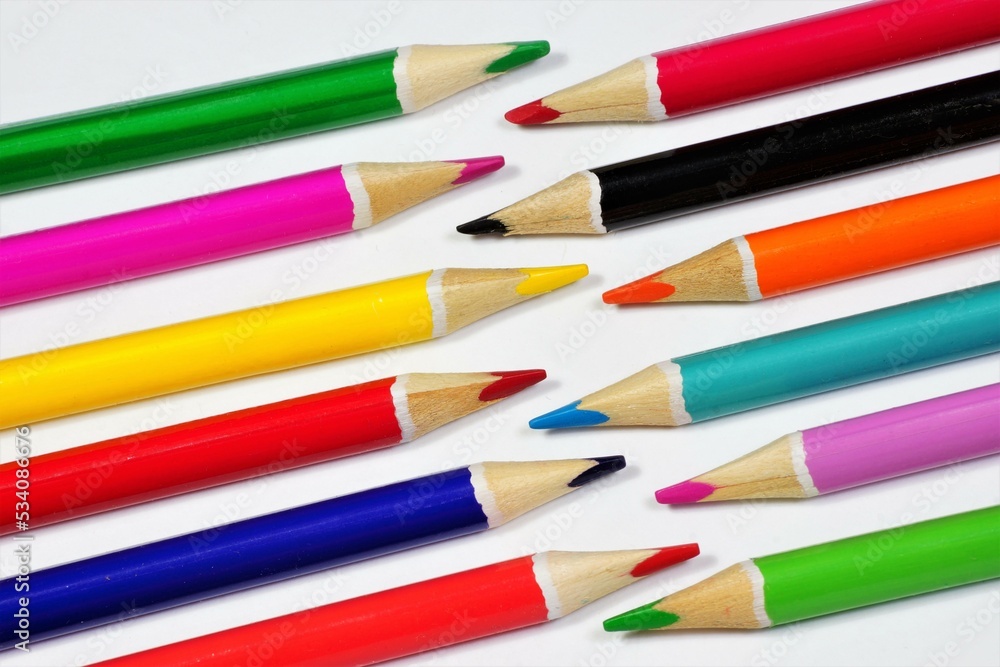 Fototapeta premium Background of colored pencils. School supplies for educational creativity.