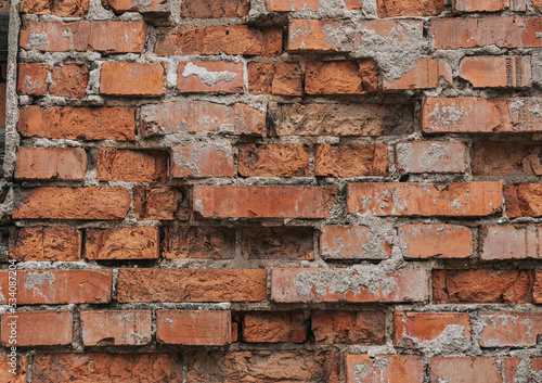 Old brick wall. Red bricks in a row background. Grunge texture