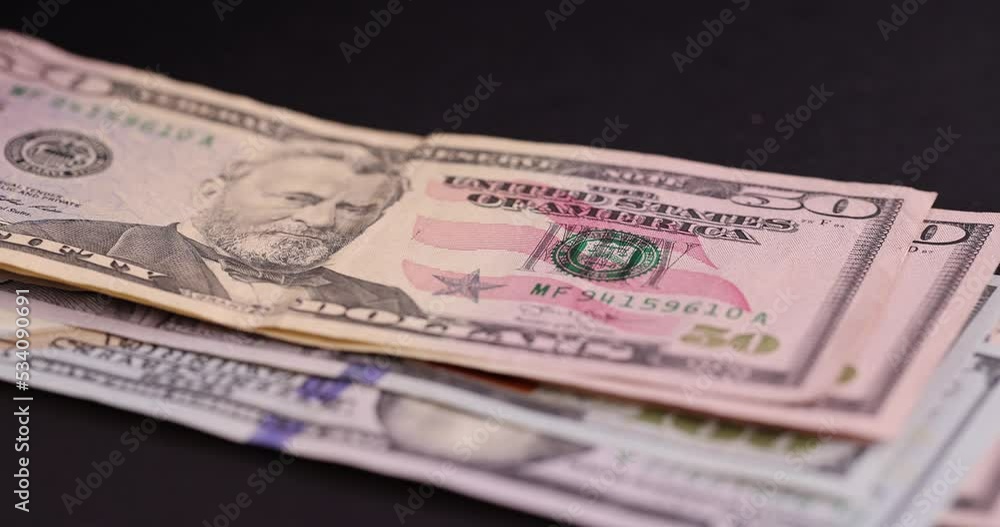 counting American cash bills on black paper, cash paper new American dollars counting American cash bills on black paper, cash paper new American dollars
