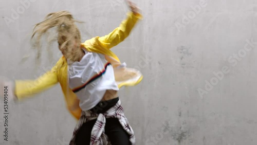 Black woman dance with energy, urban hip hop artist and creative performance outdoor. Young african street dancer, cool freestyle body movement and powerful rhythm with crazy grunge dancing in action