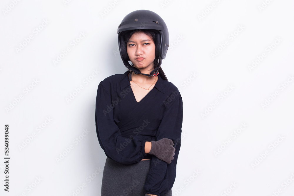 sad asian woman with a motorcycle helmet on white background
sad asian woman with a motorcycle helmet on white background