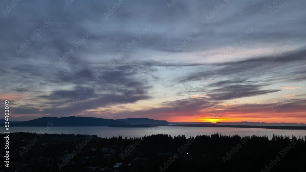 Drone shot of the sun setting over Lummi Island. Drone shot of the sun setting over Lummi Island.