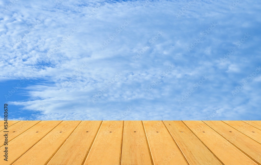 empty wooden table with blue sky background