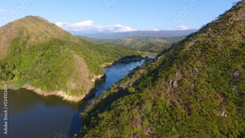 Aerial shot of the prado dam in tolima colombia over the mountains revealing the inland sea of colombia. photo