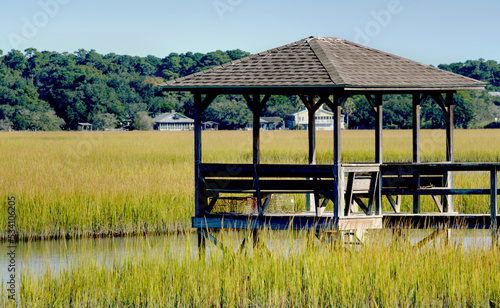 A covered dock on a salt-marsh in the fall on the Carolina coast.