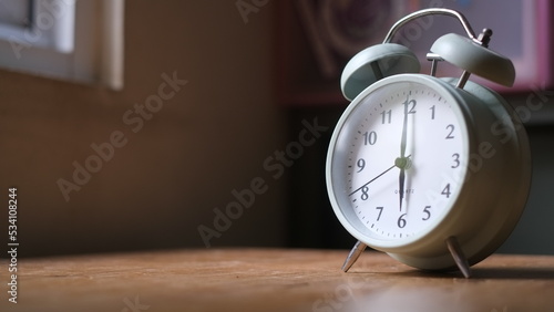 alarm on wooden table and on the window sill