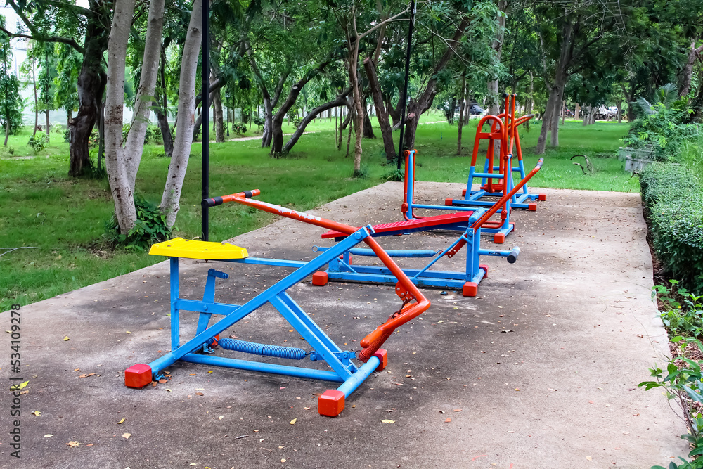 Exercise machine outdoor set in garden tree of park sport natural on background Exercise machine outdoor set in garden tree of park sport natural on background