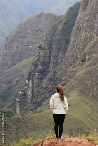 Young woman looking towards the mountains near Samaipata - Bolivia - CODO DE LOS ANDES - SANTA CRUZ BOLIVIA