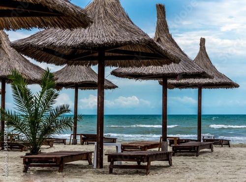 Straw umbrellas in a paradise beach, Black sea, Romania