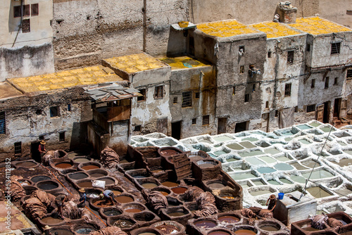The famous Chouara Tannery in the Fez medina in Morocco. The leather tannery dates back to the 11th century AD. The medina is the oldest walled part of Fez. photo