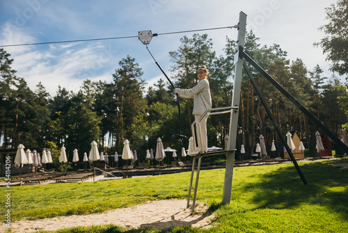Fototapeta Naklejka Na Ścianę i Meble -  Woman wants to go bungee in the rope park