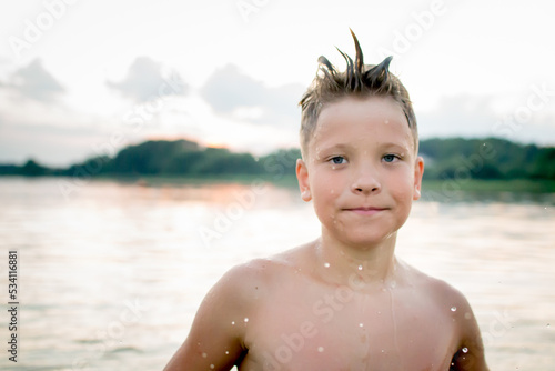 Rest on vacation. Bathing. Child at Lake Myastro