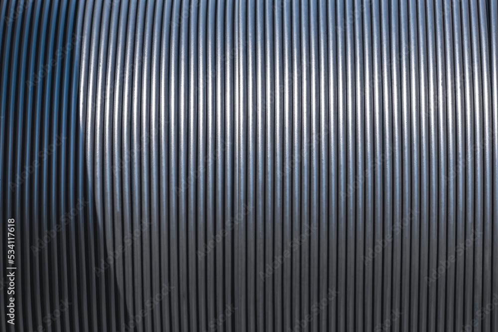 Background and texture of black fiber optic cable in single mode type on large wooden coil reel Background and texture of black fiber optic cable in single mode type on large wooden coil reel