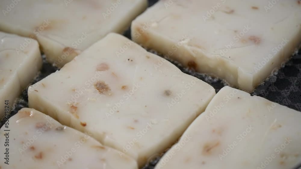 Pan-frying turnip cake, Chinese traditional local dish radish cake at home. Pan-frying turnip cake, Chinese traditional local dish radish cake at home.