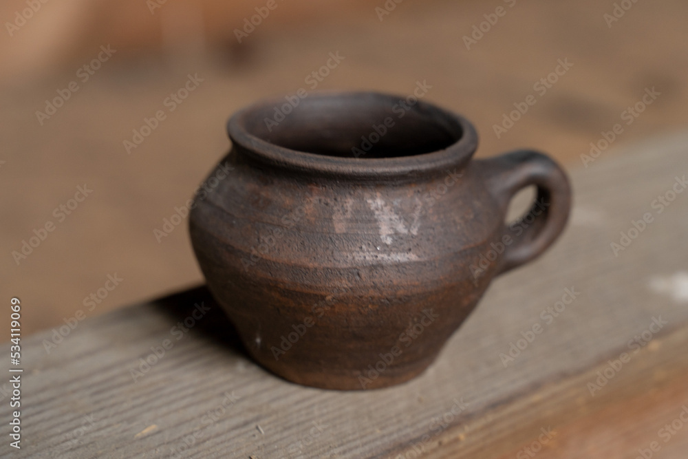 Ceramics, a ceramic product made with their own hands, made on a potter's wheel, jug, mug, clay, ornament.
