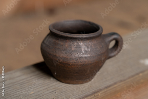 Ceramics, a ceramic product made with their own hands, made on a potter's wheel, jug, mug, clay, ornament. © nikolay_alekhin