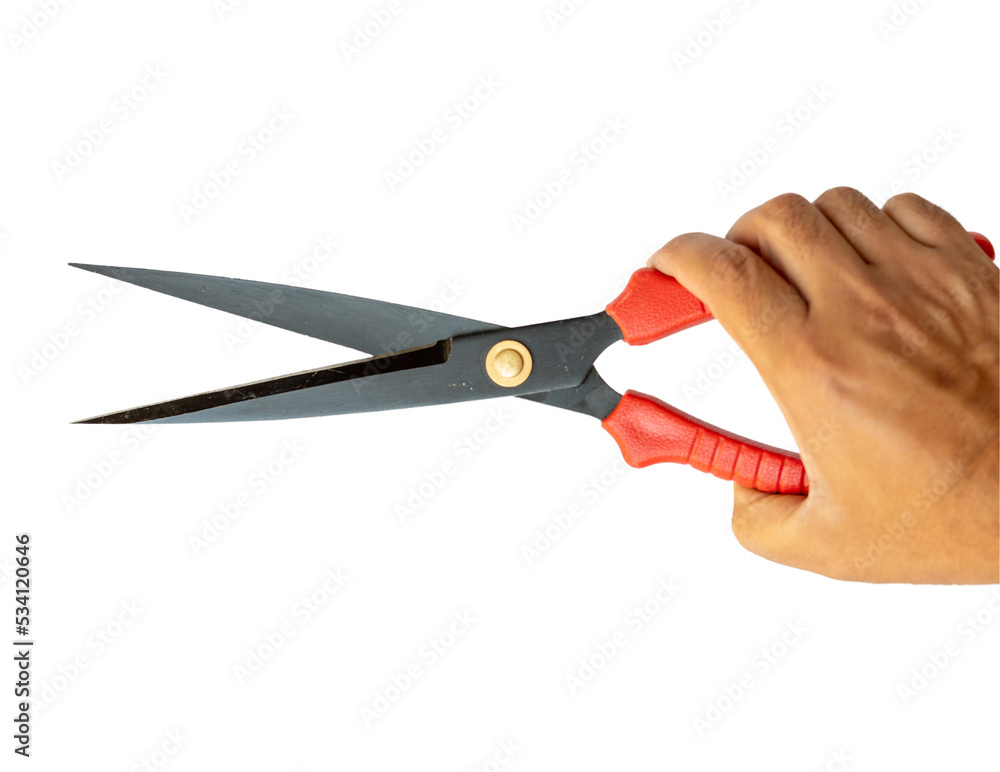 Red pruning shears holding in hand Red pruning shears holding in hand
