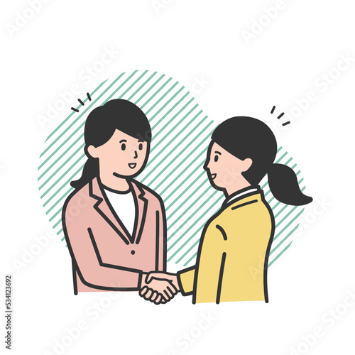 握手をする働く女性