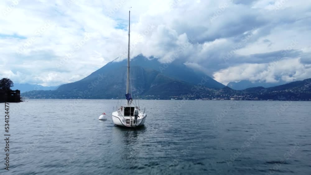 Drone flying fast and low over water with boats in Lake Como in Italy Drone flying fast and low over water with boats in Lake Como in Italy