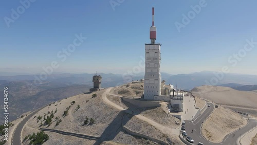 Orbit drone shot around The tower of Mont Ventoux from the North-East face during summer photo