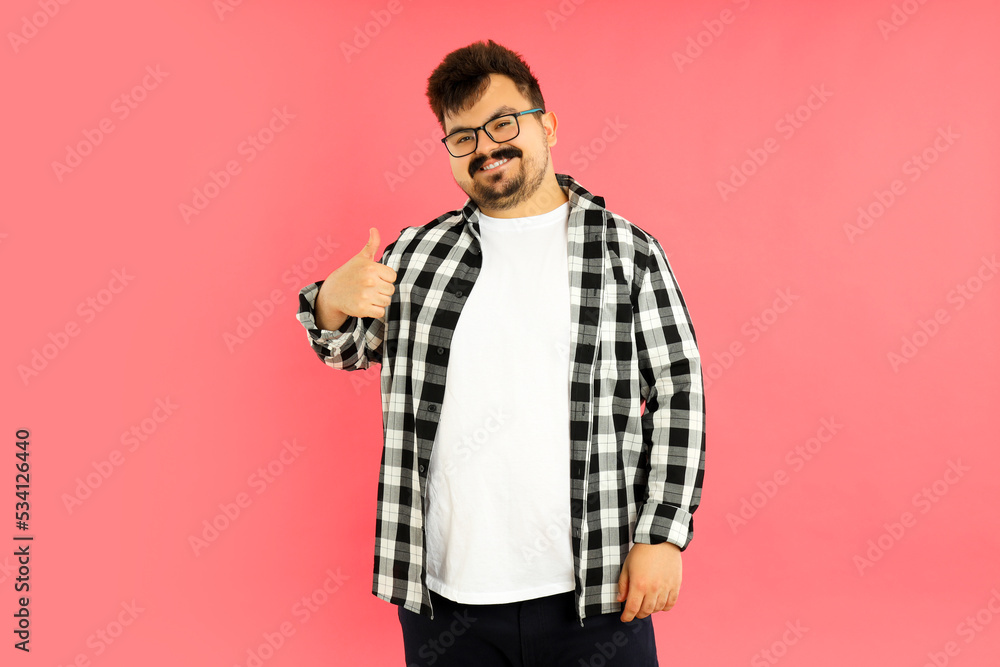 Concept of people, young fat man on pink background