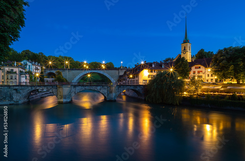 Image of historical bridges on the Aare River in Bern, capital city of Switzerland, during twilight blue hour. © Taljat