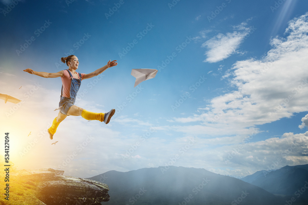 Young woman jumping in the air Young woman jumping in the air