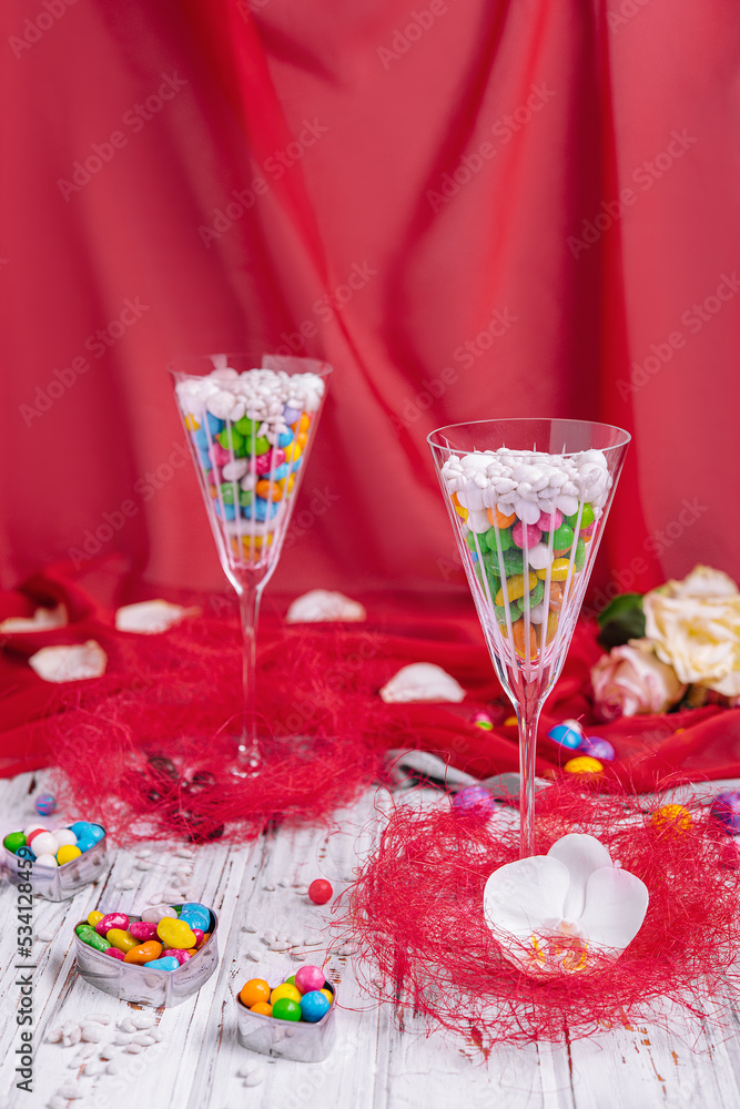 colorful sweets in champagne glasses