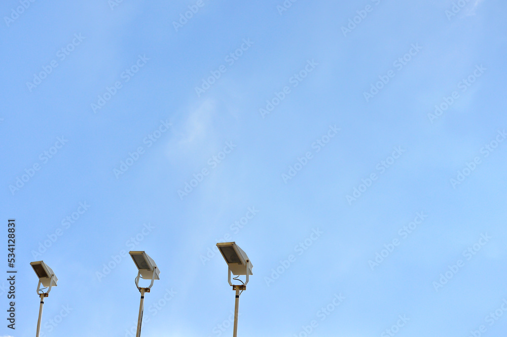 Street light lamp post led with panel system on the road with blue sky