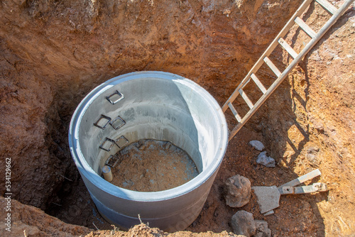 Bild auf Leinwand hole with concrete cistern at construction site