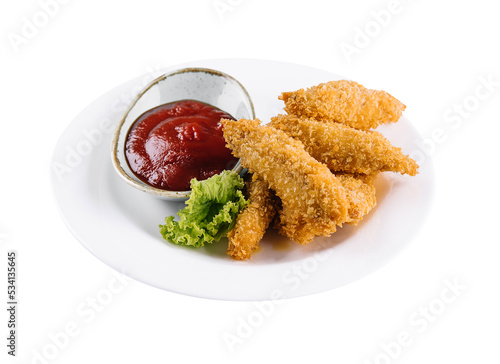 Homemade chicken nuggets with ketchup isolated