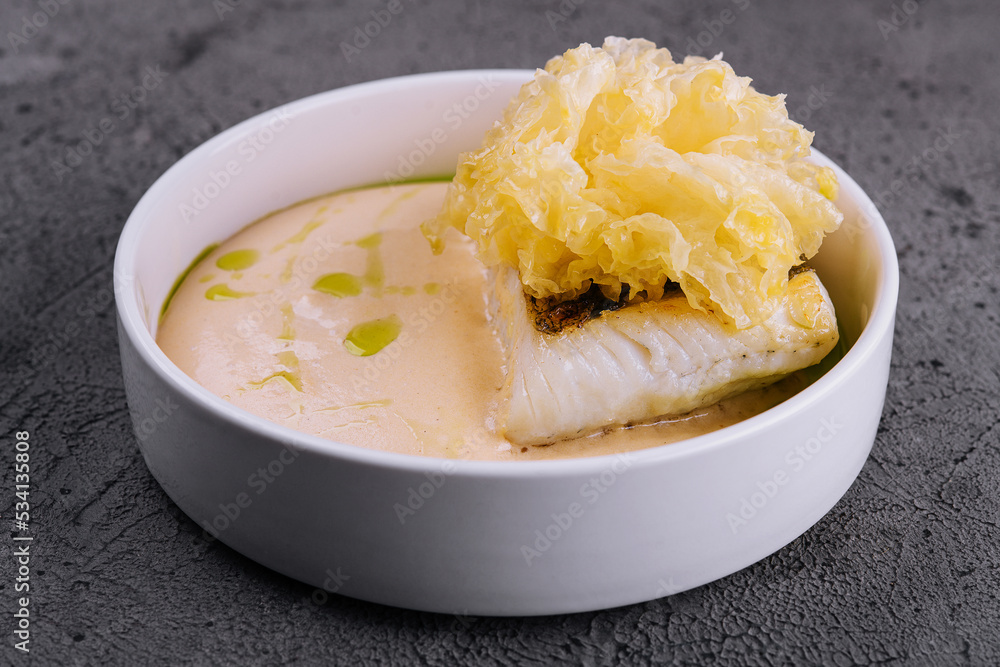 fried cod fish filet with sauce hollandaise fried cod fish filet with sauce hollandaise