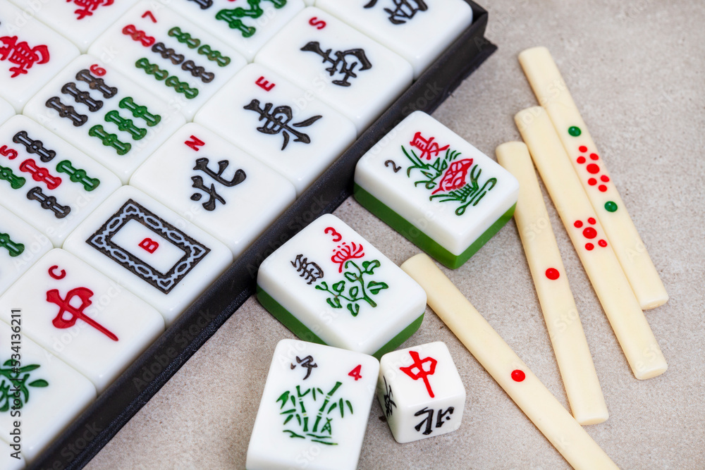 Classic mahjong board game tiles and play, ancient Chinese favorite Stock  Photo | Adobe Stock