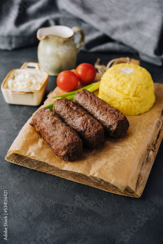 Traditional romanian grilled dish - mici or mititei photo